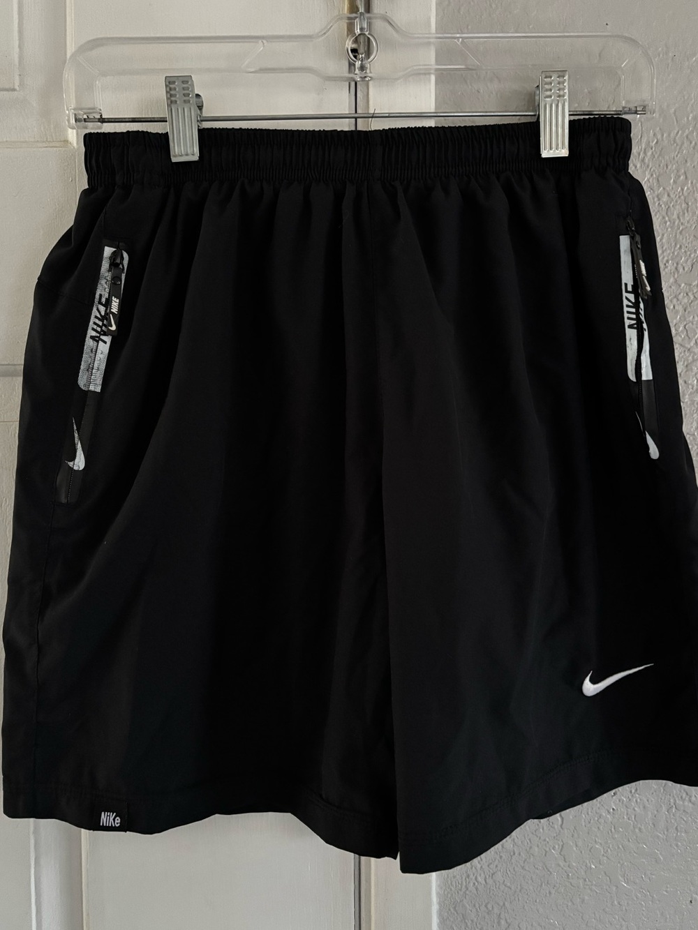 Boys Nike Black Athletic Shorts with White Swoosh
